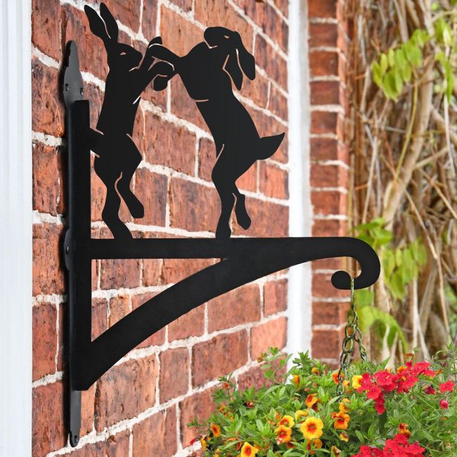 Boxing Hares Hanging Basket Bracket on Brick Wall Boxing Hares Hanging Basket Bracket on Brick Wall