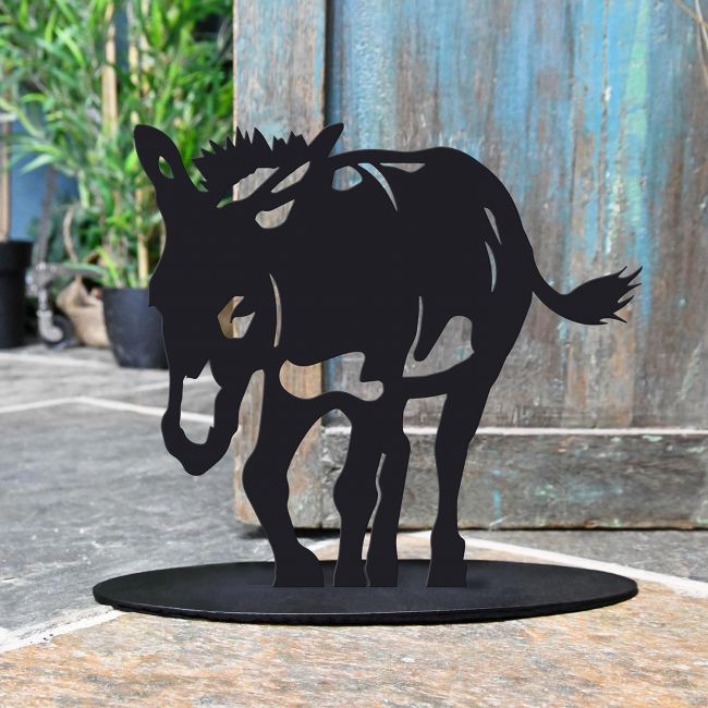 Donkey Iron Door Stop Next to a Rustic Blue Door Donkey Iron Door Stop Next to a Rustic Blue Door