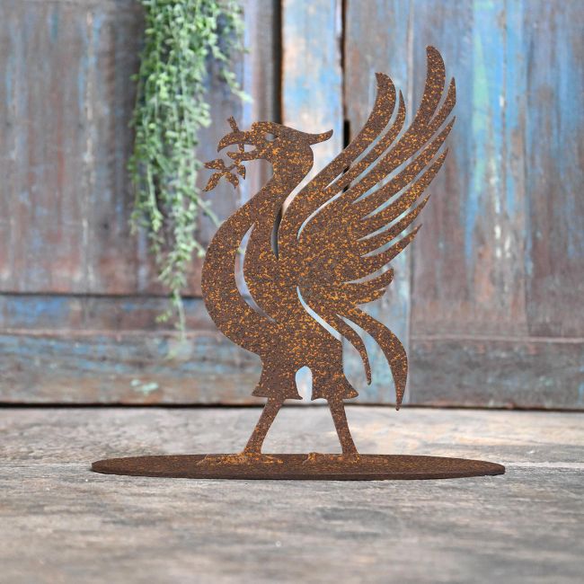 Liver Bird Rustic Iron Door Stop in Front of a Rustic Blue Door Liver Bird Rustic Iron Door Stop in Front of a Rustic Blue Door