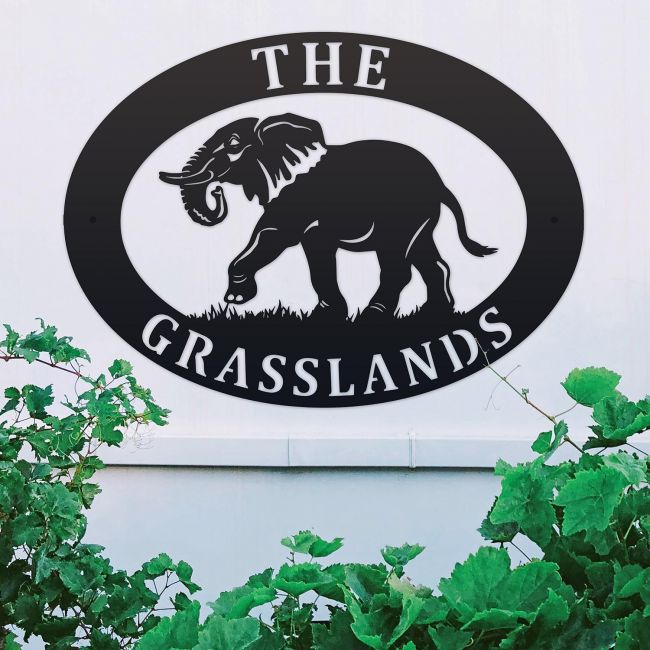 Elephant Iron Oval House Sign on a White Wall