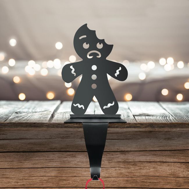 Bitten Gingerbread Man Stocking Holder in Situ on a Mantel Piece Bitten Gingerbread Man Stocking Holder in Situ on a Mantel Piece