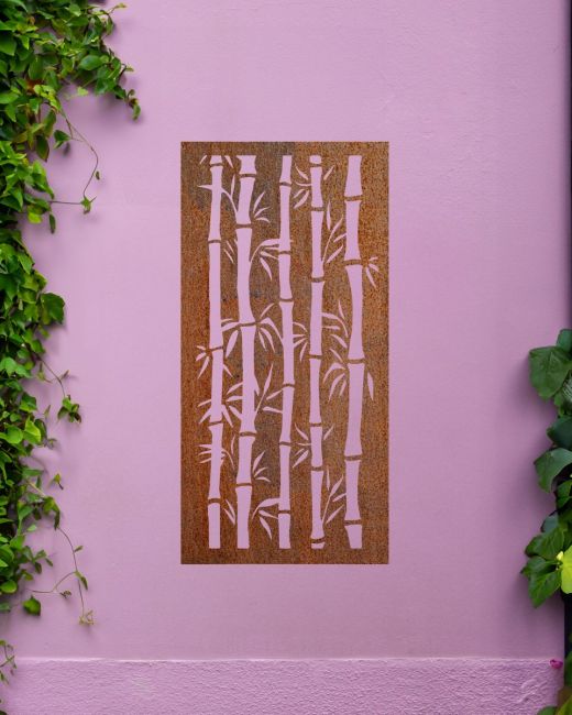 Rust Finish "Bamboo Garden Wall Art" mounted on a purple garden wall with creeping plants Rust Finish "Bamboo Garden Wall Art" mounted on a purple garden wall with creeping plants