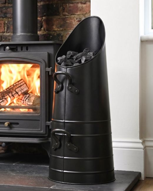 The Traditional "Norfolk" Coal Hod Filled with Coal in a Cream Living Room Interior - Digital Illustration The Traditional "Norfolk" Coal Hod Filled with Coal in a Cream Living Room Interior - Digital Illustration