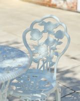 Close up of blossoming flower backrest detail on patio furniture set