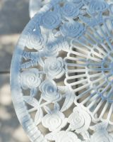 Close up of intricate table top detail on outdoor two seater table and chairs set