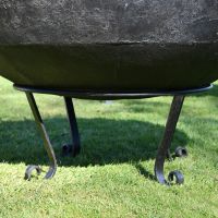 Close up of Traditional Kadai Bowl and scroll stand 