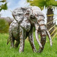 Recycled Metal Elephant with Trunk Up in Situ in the Garden