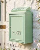 The Mint Green "Oxford" Wall Mounted Post Box with Silver Detail Displayed on the Front of a Modern House - Digital Illustration The Mint Green "Oxford" Wall Mounted Post Box with Silver Detail Displayed on the Front of a Modern House - Digital Illustration
