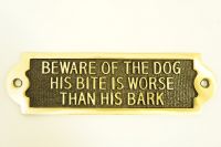 Beware of the dog his bite is worse than his bark - Gate sign