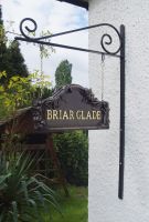 Bronze Double Sided House Sign Mounted on Wall