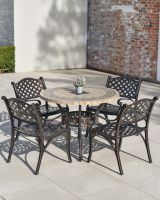 "Abberton" Antique Copper Four Seater Dining Set in Situ Outside on a Patio "Abberton" Antique Copper Four Seater Dining Set in Situ Outside on a Patio