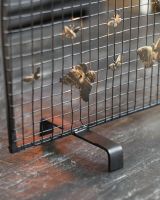 Close-Up of Arched Feet for "Butterfly" Black & Bronze Fire Screen