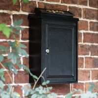 "Charlton Grange" Wall Mounted Post Box with Polished Brass Lettering in Situ on a Brick Wall