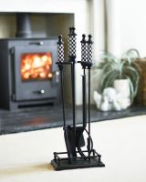 "The Ludos" Checkered White & Black Companion Set in Front of a Modern Fireplace  - Digital Illustration