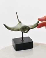 "Abyssal Glider" Ray Cast Brass Ornament with hand in shot for scale