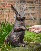 "Barnaby" the Rabbit Cast Aluminium Garden Sculpture with hand in shot for scale