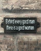 "Behind Every Good Man there is a Good Woman" Traditional Cast Iron Wall Sign mounted on a brick wall