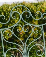 "Belvedere" Garden Rocking Bench Wrought Iron - Sage close up of scrollwork "Belvedere" Garden Rocking Bench Wrought Iron - Sage close up of scrollwork