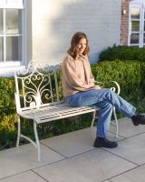 "Belvedere" Wrought Iron Garden Bench - Cream with lady sat on bench
