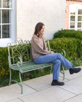 "Belvedere" Wrought Iron Garden Bench with lady sat on bench