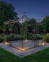 "Benvelia’s Gateway" Gazebo at night with lights ai