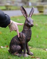"Briar" the Hare Cast Aluminium Garden Sculpture - Copper to scale with hand in shot for reference