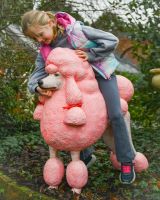 ‘Candyfloss’ the Poodle Fibreglass Garden Sculpture child sat on top petting the poodle ‘Candyfloss’ the Poodle Fibreglass Garden Sculpture child sat on top petting the poodle