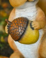 "Caper" the Handpainted Fibreglass Squirrel Garden Sculpture close up of acorn