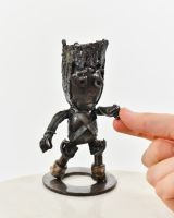 "Duke" Upcycled Metal Art Sculpture with hand in shot for scale