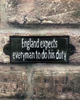 "England Expects Everyman to do their Duty" Traditional Cast Iron Wall Sign mounted on brick wall