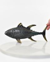 "Gilded Glider" Tuna Ornament in Cast Brass with hand in shot for scale
