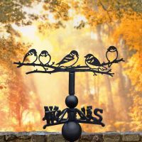 Group of sparrows weathervane in autumn 