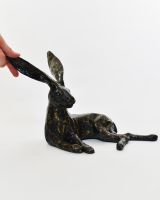 "Hearthside Hare" Cast Brass Lying Hare Sculpture with hand in shot for scale