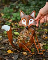 "Hutch" Steel Fox Garden Sculpture - Sitting with hand in shot for scale