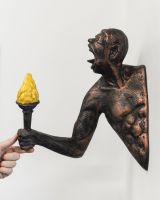 "Ignite" Cast Aluminium Wall Art in Bronze and Copper Finish with hand in shot for scale