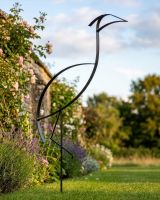 The "Kestin" the Minimalist Heron Garden Sculpture Plant Spike in a Black Finish Positioned in a Sunny Walled Garden - Digital Illustration The "Kestin" the Minimalist Heron Garden Sculpture Plant Spike in a Black Finish Positioned in a Sunny Walled Garden - Digital Illustration