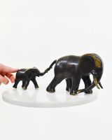 "Matriarch"s Guidance" Cast Brass Elephant Ornament with hand in shot for scale