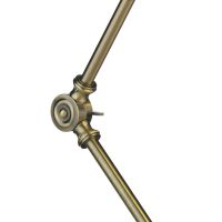 Close-up of the Antique Brass Arm on the Desk Lamp Close-up of the Antique Brass Arm on the Desk Lamp