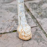 View of the Feet on the "Merriweather" Round Cast Aged Rustic Cream Iron Victorian Table