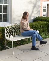 ‘Monet’ Two Seater Wrought Iron Garden Bench lady sitting on bench