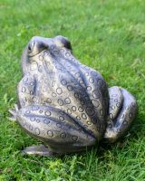 Gold Version of the "Morty" the Toad Cast Aluminium Garden Sculpture Positioned on a Lawn with a Close up of the Back Detailing Gold Version of the "Morty" the Toad Cast Aluminium Garden Sculpture Positioned on a Lawn with a Close up of the Back Detailing