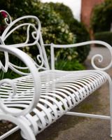 "Papillon" Contemporary Wrought Iron Two Seater Garden Bench Close up of Contoured Seat
