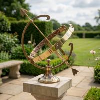 Digital illustration of "Profatius" Antique Brass Armillary - 24cm in front of wild flowers mounted on a plinth