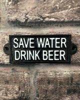 "Save Water Drink Beer" Traditional Cast Iron Wall Sign mounted on a brick wall