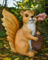 "Scurry" the Handpainted Fibreglass Squirrel Garden Sculpture with hand in shot for scale