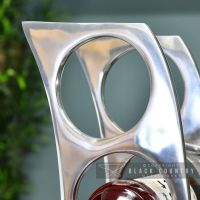 Close-up of the round Holes for Inserting the Wine Bottles