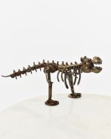 "Snap" Upcycled Metal T-Rex Ornament angled view of t-rex