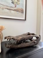 "Sobek" Cast Brass Crocodile Skull Sculpture on table
