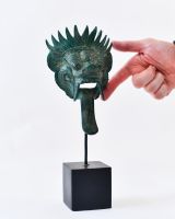 "Sovereign Guardian" Cast Brass Balinese Mask Ornament with hand in shot for scale