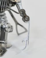 ‘Stainless Sentinel’ Upcycled Stainless Steel Robot close up of arm which is a bottle opener